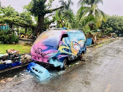 Colorful Cars by SKOPE. This Graffiti is located in Bocas Del Toro, Panama and was created in 2019. This Graffiti can be described as Cars and Handstyles.