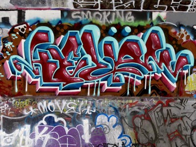 Cyan and Red Stylewriting by Kezam. This Graffiti is located in Vancouver, Canada and was created in 2022. This Graffiti can be described as Stylewriting and 3D.