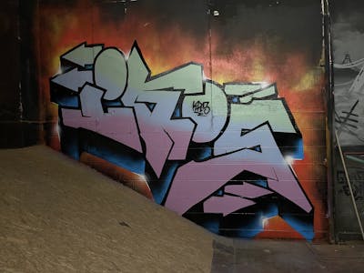 Colorful and Coralle Stylewriting by IKOS. This Graffiti is located in Döbeln, Germany and was created in 2023. This Graffiti can be described as Stylewriting and Wall of Fame.