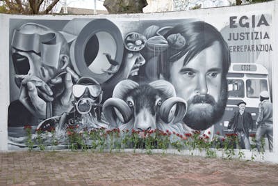 Grey Characters by Nexgraff. This Graffiti is located in donostia, Spain and was created in 2020. This Graffiti can be described as Characters, 3D and Murals.