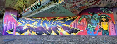 Colorful Stylewriting by Riots, Kasimir and lais. This Graffiti is located in Dresden, Germany and was created in 2023. This Graffiti can be described as Stylewriting, Characters and Wall of Fame.