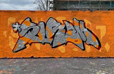 Orange and Chrome Stylewriting by Sirom. This Graffiti is located in Leipzig, Germany and was created in 2023. This Graffiti can be described as Stylewriting and Wall of Fame.