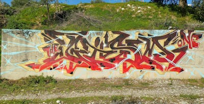 Red and Beige and Brown Stylewriting by Gizmo. This Graffiti is located in Agrinio, Greece and was created in 2023.