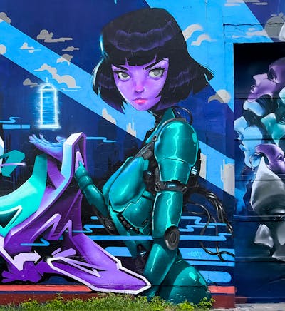 Blue and Violet and Cyan Characters by Emty. This Graffiti is located in Radebeul, Germany and was created in 2023. This Graffiti can be described as Characters, Streetart and Murals.