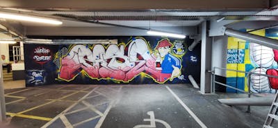 Colorful and White and Coralle Stylewriting by Pase. This Graffiti is located in Wrexham, United Kingdom and was created in 2023. This Graffiti can be described as Stylewriting, Characters and Wall of Fame.