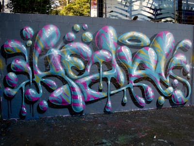 Cyan and Coralle Stylewriting by Kezam. This Graffiti is located in Auckland, New Zealand and was created in 2023. This Graffiti can be described as Stylewriting and 3D.