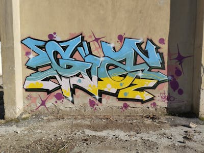Cyan and Yellow Stylewriting by Gizmo. This Graffiti is located in Thessaloniki, Greece and was created in 2024. This Graffiti can be described as Stylewriting and Abandoned.