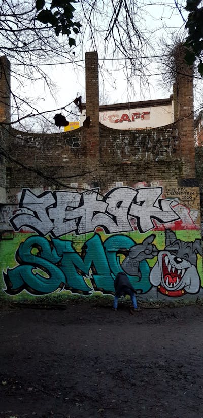 Cyan and Grey Stylewriting by smo__crew. This Graffiti is located in London, United Kingdom and was created in 2021. This Graffiti can be described as Stylewriting and Characters.