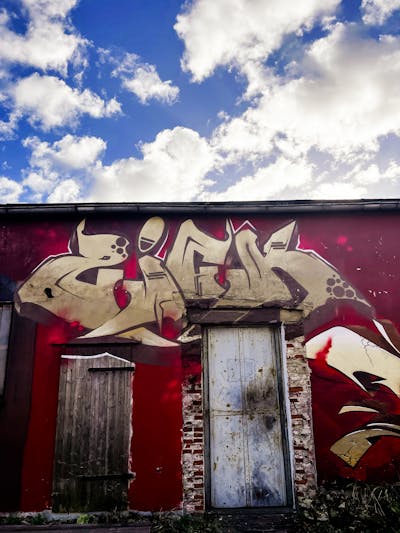 Gold and Red Stylewriting by ZICK and PMZ. This Graffiti is located in Leer, Germany and was created in 2023. This Graffiti can be described as Stylewriting, Atmosphere and Abandoned.