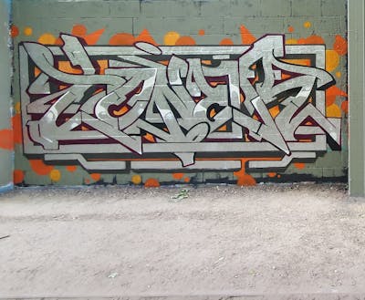 Chrome and Orange Stylewriting by Toner2 and OTZ. This Graffiti is located in Belgium and was created in 2020.