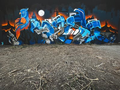 Orange and Blue Stylewriting by Moseg, Salzig and omseg. This Graffiti is located in Freiburg, Germany and was created in 2022. This Graffiti can be described as Stylewriting, Characters and Wall of Fame.
