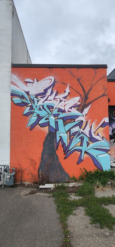 Light Blue and Orange Stylewriting by Chew. This Graffiti is located in United States and was created in 2022.