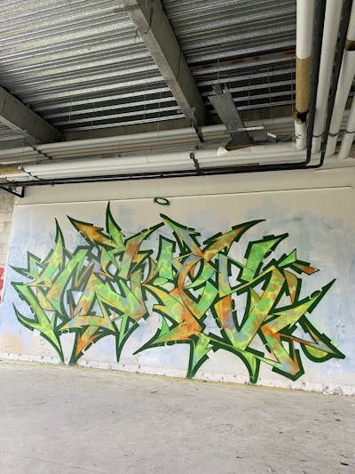 Green and Orange Stylewriting by _mekes_. This Graffiti is located in France and was created in 2023. This Graffiti can be described as Stylewriting and Abandoned.