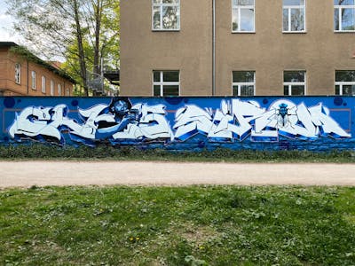 Blue and White Stylewriting by Chr15 and Sirom. This Graffiti is located in Jena, Germany and was created in 2022. This Graffiti can be described as Stylewriting, Characters and Wall of Fame.