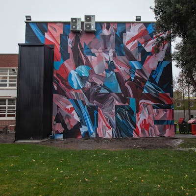 Light Blue and Red Murals by Askew. This Graffiti is located in Christchurch, New Zealand and was created in 2021. This Graffiti can be described as Murals.