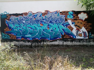 Cyan and Brown and Blue Stylewriting by Biwis. This Graffiti is located in madrid, Spain and was created in 2023. This Graffiti can be described as Stylewriting and Characters.