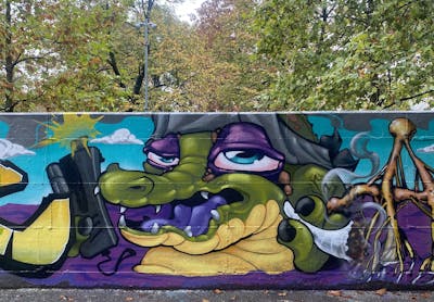 Green and Colorful Characters by Gaber. This Graffiti is located in Torino, Italy and was created in 2022. This Graffiti can be described as Characters and Wall of Fame.