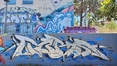 Chrome and Blue and Grey Stylewriting by Tebs. This Graffiti is located in Athens, Greece and was created in 2023.
