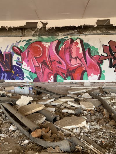 Red and Light Green Stylewriting by APSET, Merlin and DEM. This Graffiti is located in Lemnos, Greece and was created in 2021. This Graffiti can be described as Stylewriting and Abandoned.