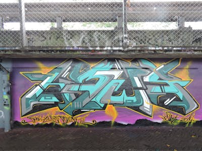 Cyan and Grey Stylewriting by News. This Graffiti is located in Amsterdam, Netherlands and was created in 2014. This Graffiti can be described as Stylewriting and Wall of Fame.