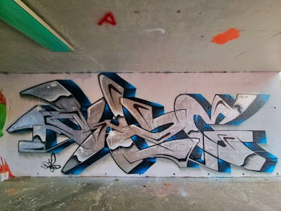 Chrome and Black and Blue Stylewriting by Dyze. This Graffiti is located in Bern, Switzerland and was created in 2023. This Graffiti can be described as Stylewriting and Wall of Fame.