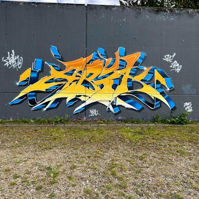 Orange and Light Blue and Yellow Stylewriting by Abik. This Graffiti is located in Hamburg, Germany and was created in 2023.
