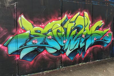 Cyan and Light Green and Red Stylewriting by SQWR. This Graffiti is located in London, United Kingdom and was created in 2023.