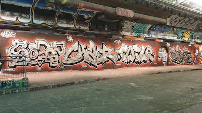 Chrome and Orange and Black Stylewriting by Sorez, Char, Sky High, smo__crew and Toile. This Graffiti is located in London, United Kingdom and was created in 2022. This Graffiti can be described as Stylewriting and Wall of Fame.