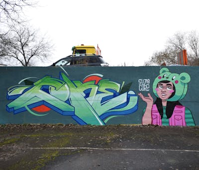 Light Green and Light Blue and Colorful Stylewriting by Coke and Suzie. This Graffiti is located in Budapest, Hungary and was created in 2023. This Graffiti can be described as Stylewriting and Characters.