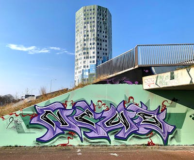 Cyan and Violet Stylewriting by News. This Graffiti is located in Groningen, Netherlands and was created in 2022. This Graffiti can be described as Stylewriting and Wall of Fame.