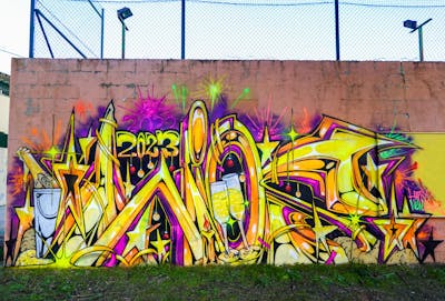 Yellow and Violet Stylewriting by Wios. This Graffiti is located in Spain and was created in 2023. This Graffiti can be described as Stylewriting and Characters.