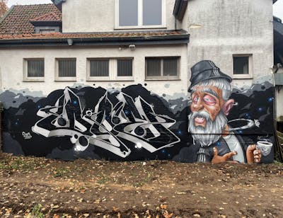 Black and Grey and Beige Stylewriting by Tokk and Doe. This Graffiti is located in Germany and was created in 2022. This Graffiti can be described as Stylewriting, Characters and Murals.