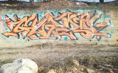 Orange and Black and Cyan Stylewriting by Gizmo. This Graffiti is located in Agrinio, Greece and was created in 2023.