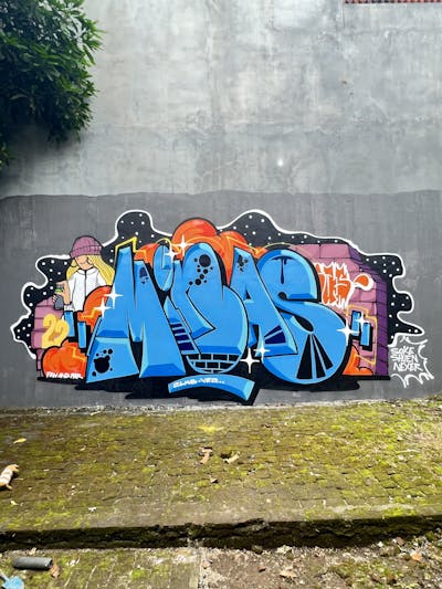 Light Blue and Colorful Stylewriting by Minas. This Graffiti is located in Yogyakarta, Indonesia and was created in 2022. This Graffiti can be described as Stylewriting, Characters and Wall of Fame.