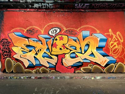 Orange and Blue Stylewriting by Techno and CAS. This Graffiti is located in London, United Kingdom and was created in 2021. This Graffiti can be described as Stylewriting, Characters and Wall of Fame.