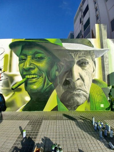 Grey and Light Green Characters by Nexgraff and Nesui. This Graffiti is located in Las Palmas de Gran Canaria, Spain and was created in 2021. This Graffiti can be described as Characters, 3D and Murals.