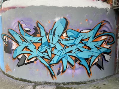 Cyan and Orange Stylewriting by EmzG. This Graffiti is located in Zug, Switzerland and was created in 2022. This Graffiti can be described as Stylewriting and Wall of Fame.