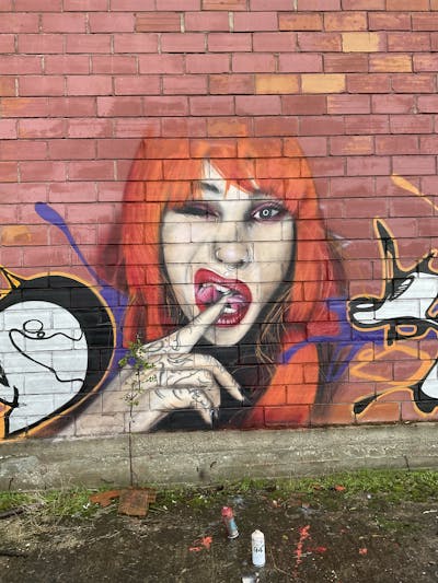 Beige and Orange Characters by serman. This Graffiti is located in Ampelonas, Greece and was created in 2023.