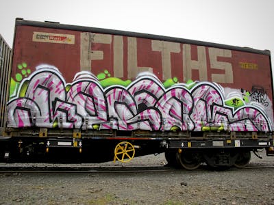 Chrome and Violet and Light Green Stylewriting by Kezam. This Graffiti is located in Auckland, New Zealand and was created in 2022. This Graffiti can be described as Stylewriting, Trains and Freights.