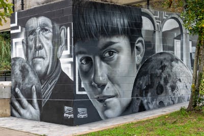 Grey Characters by Nexgraff. This Graffiti is located in donostia, Spain and was created in 2022. This Graffiti can be described as Characters, 3D and Murals.
