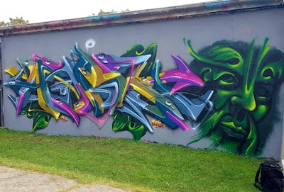 Colorful and Green Stylewriting by angst. This Graffiti is located in Dessau, Germany and was created in 2022. This Graffiti can be described as Stylewriting, Characters, 3D and Wall of Fame.