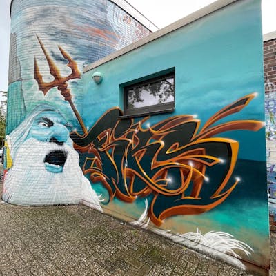 Cyan and Grey and Brown Characters by Fiks and MicRoFiks. This Graffiti is located in Oldenburg, Germany and was created in 2023. This Graffiti can be described as Characters, Stylewriting and Streetart.