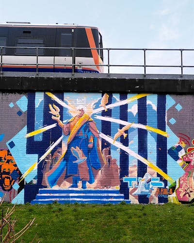 Colorful and Light Blue Characters by Tris. This Graffiti is located in London, United Kingdom and was created in 2024. This Graffiti can be described as Characters, Streetart and Wall of Fame.