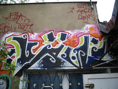 Colorful Stylewriting by urine and OST. This Graffiti is located in Wolfen, Germany and was created in 2005.