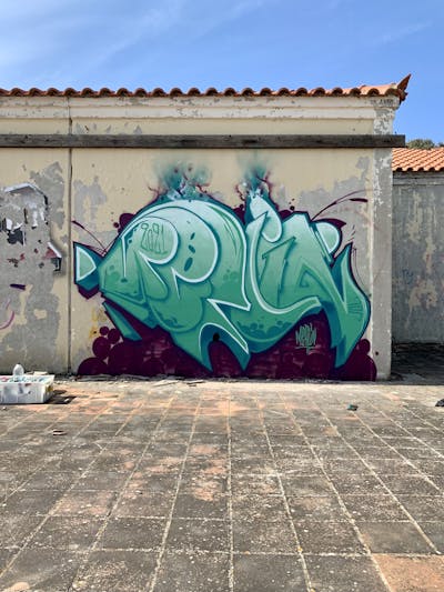 Violet and Cyan Stylewriting by APSET, DEM and Merlin. This Graffiti is located in Lemnos, Greece and was created in 2021. This Graffiti can be described as Stylewriting and Abandoned.