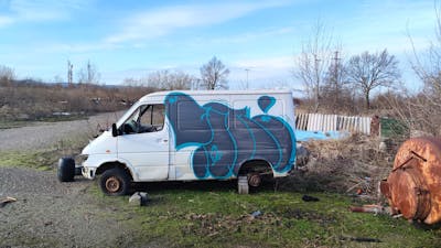 Blue and Light Blue Cars by 7AM. This Graffiti is located in Novi Sad, Serbia and was created in 2024. This Graffiti can be described as Cars, Abandoned and Throw Up.