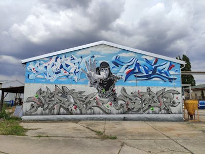 Light Blue and Grey Stylewriting by Utopia, casom, Imor and Shrine. This Graffiti is located in Germany and was created in 2021. This Graffiti can be described as Stylewriting, Characters and Murals.