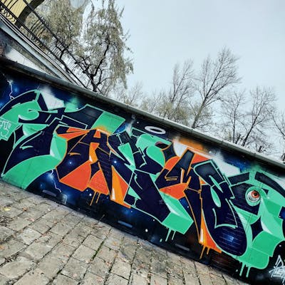 Cyan and Orange Stylewriting by Fems173. This Graffiti is located in lublin, Poland and was created in 2022. This Graffiti can be described as Stylewriting and Wall of Fame.