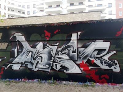 Grey and Red Wall of Fame by Aser. This Graffiti is located in Berlin, Germany and was created in 2022. This Graffiti can be described as Wall of Fame and Stylewriting.
