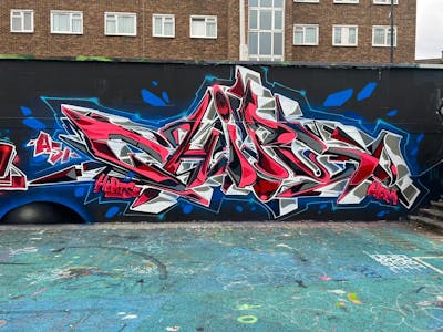 Red and Blue and Grey Stylewriting by Chips. This Graffiti is located in London, United Kingdom and was created in 2022. This Graffiti can be described as Stylewriting and Wall of Fame.